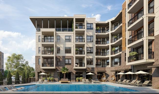 a large building with a pool in front of it