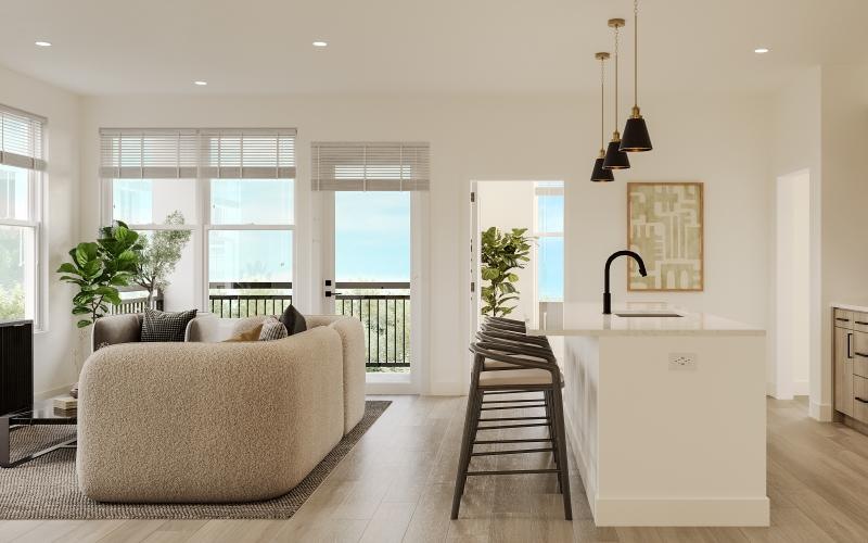 a large living room with a couch and a table