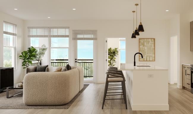 a large living room with a couch and a table